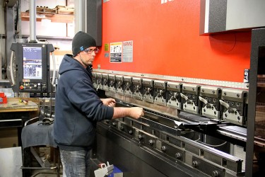 Man working on printing press